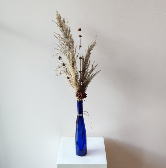 Tall Blue Glass Bottle Arrangement